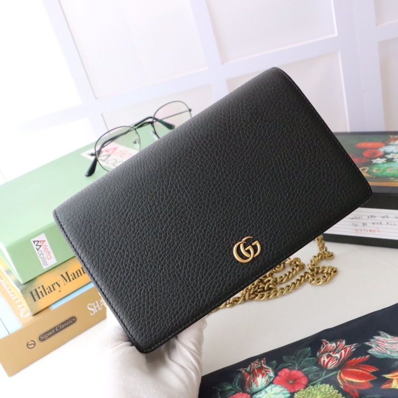 G*u*i clutch bags